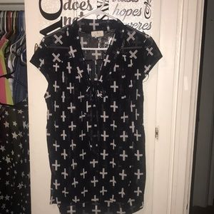 Navy blue blouse w/ white crosses.